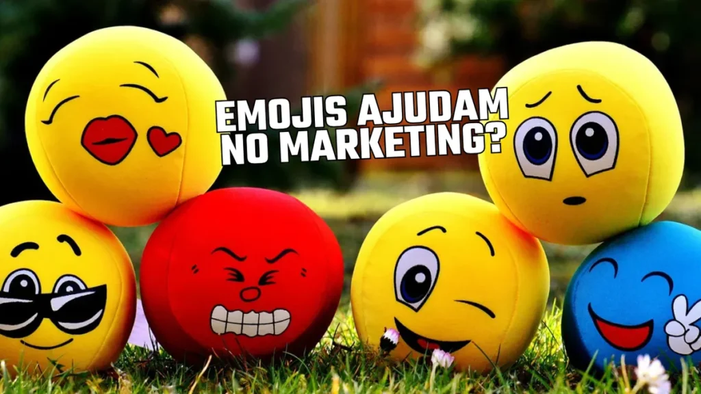 Afinal, emojis ajudam no marketing? 8 Bolinhas de pelúcia com rostos de emojis sobre a grama e a pergunta Emojis ajudam no marketing?